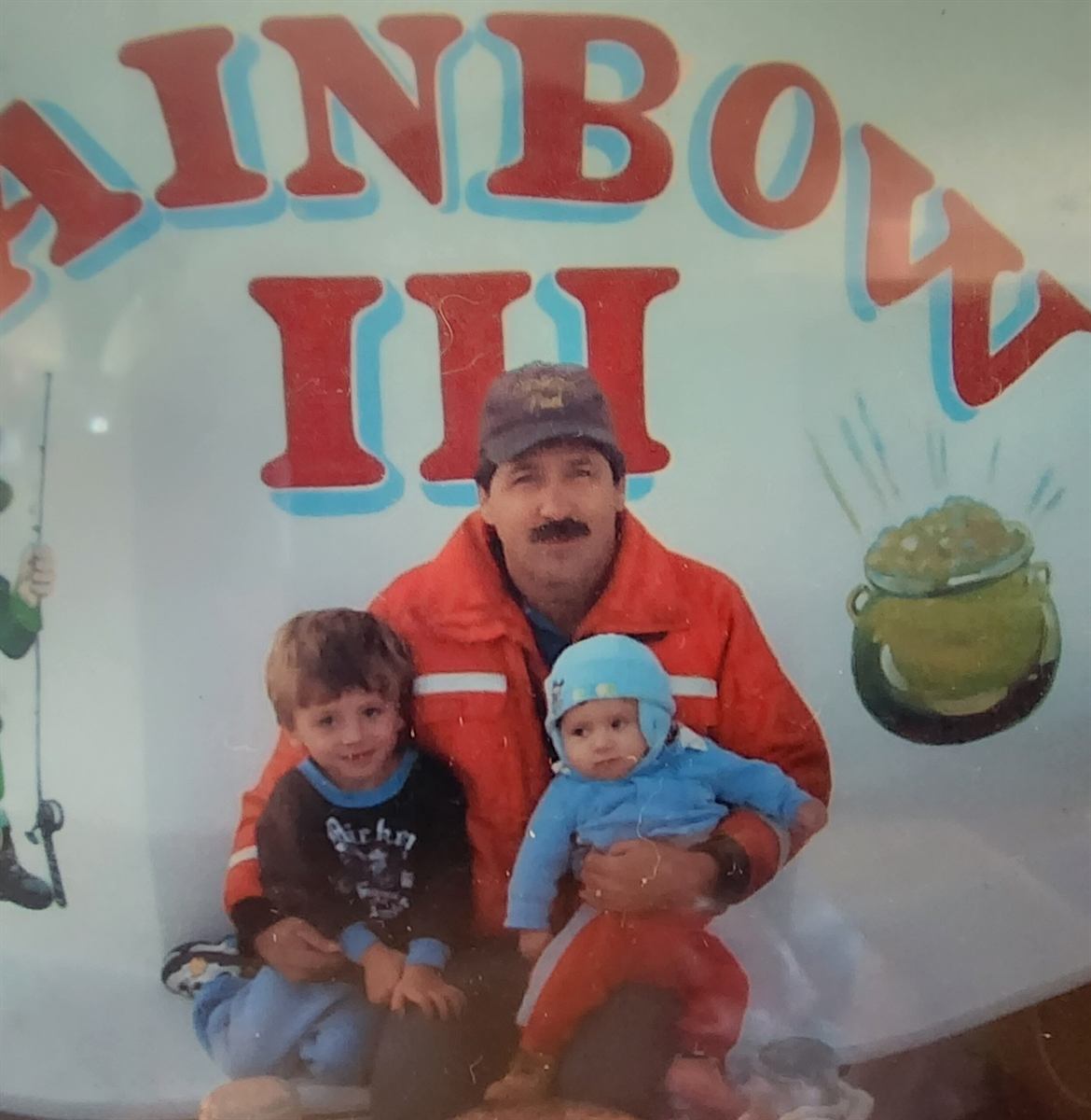 A young Captain Hartley with his kids aboard the Rainbow III